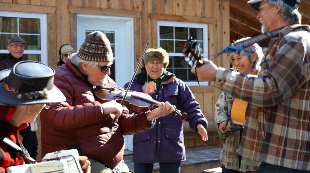 Musicians and dancers outside the Sugar Shack